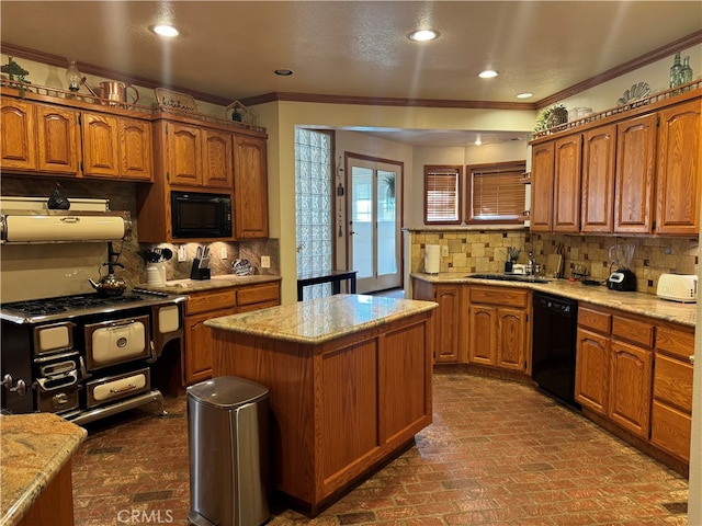 kitchen featuring a kitchen island, backsplash, ornamental molding, and black appliances