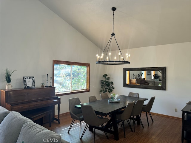 dining area with a notable chandelier, dark wood-type flooring, and high vaulted ceiling