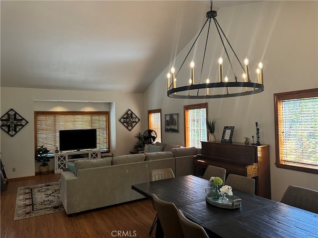 dining space with lofted ceiling and hardwood / wood-style flooring