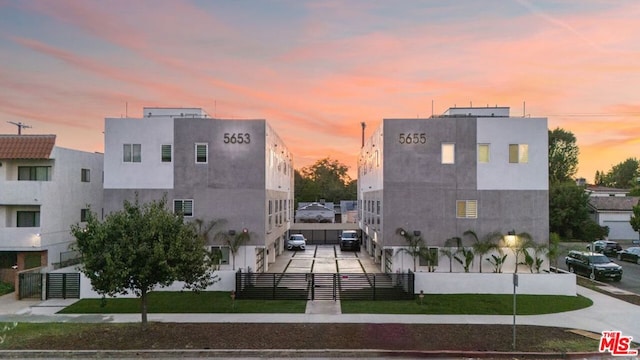 view of outdoor building at dusk