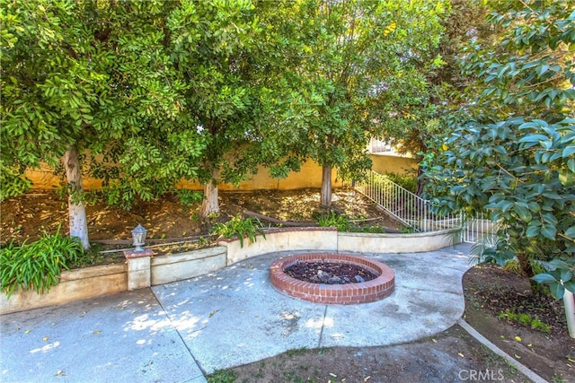 view of patio / terrace with an outdoor fire pit