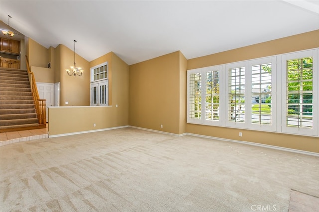 unfurnished living room featuring carpet floors, vaulted ceiling, and a notable chandelier