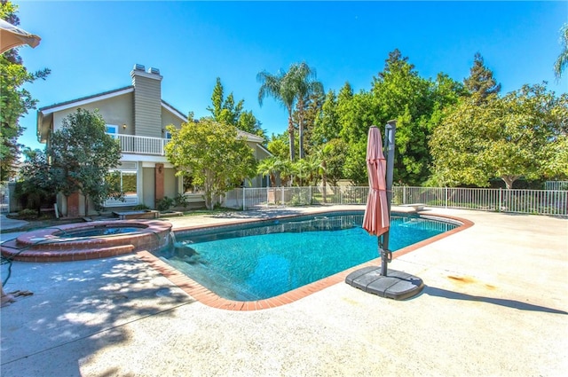 view of pool featuring an in ground hot tub, a patio, and a diving board