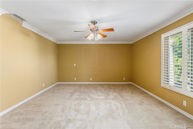 carpeted empty room with ornamental molding and ceiling fan