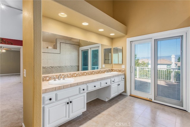 bathroom with tile patterned floors, ceiling fan, and vanity