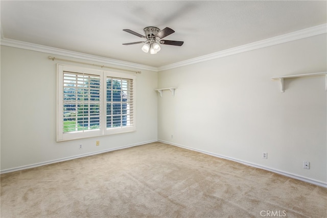 carpeted empty room featuring crown molding and ceiling fan