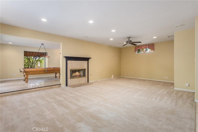 unfurnished living room with pool table, ceiling fan, and light colored carpet