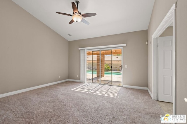 empty room with light carpet, vaulted ceiling, and ceiling fan