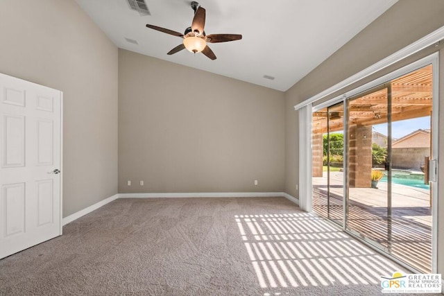 carpeted spare room with ceiling fan and lofted ceiling