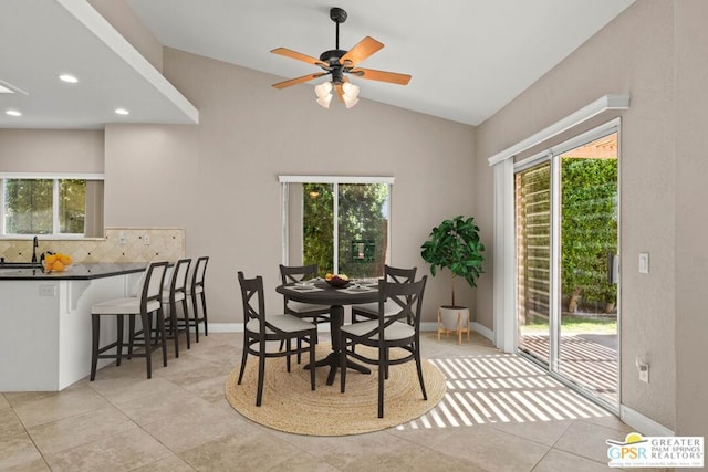 dining area with lofted ceiling, a healthy amount of sunlight, and ceiling fan