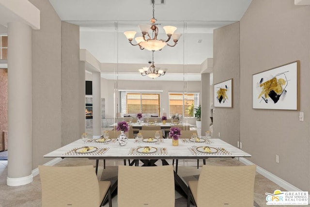 dining space featuring a notable chandelier