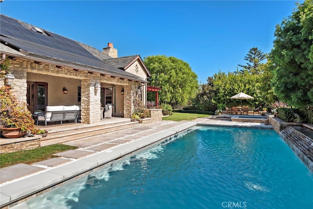 view of swimming pool featuring an outdoor hangout area and a patio