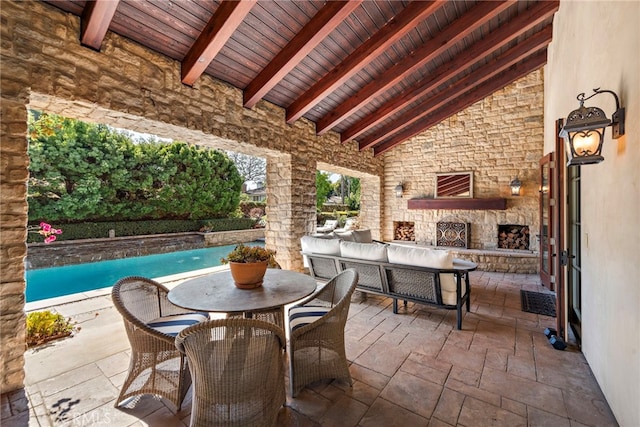 view of patio featuring an outdoor living space with a fireplace