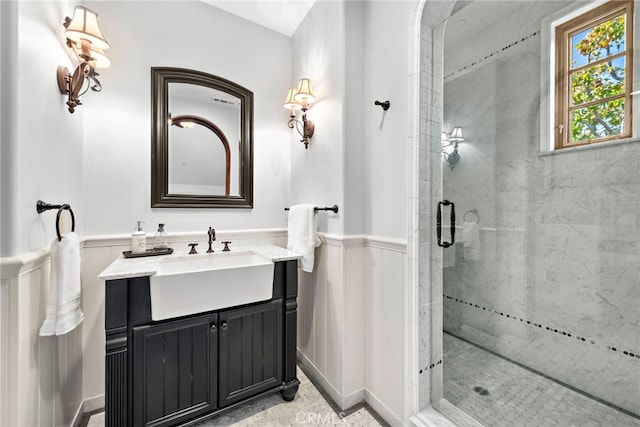 bathroom featuring vanity and an enclosed shower