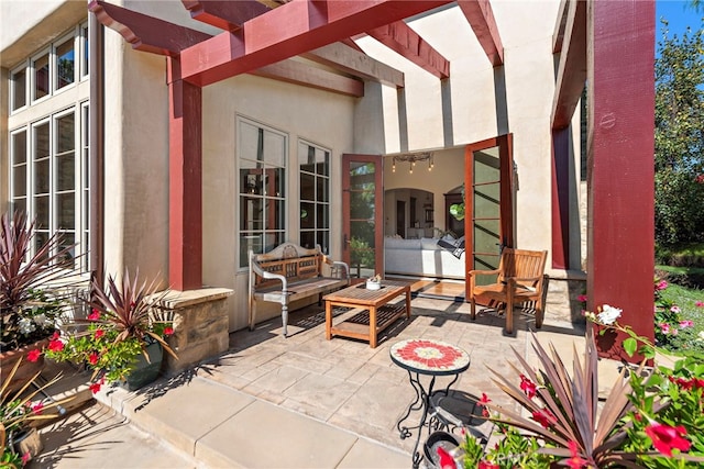 view of patio / terrace featuring an outdoor hangout area and a pergola