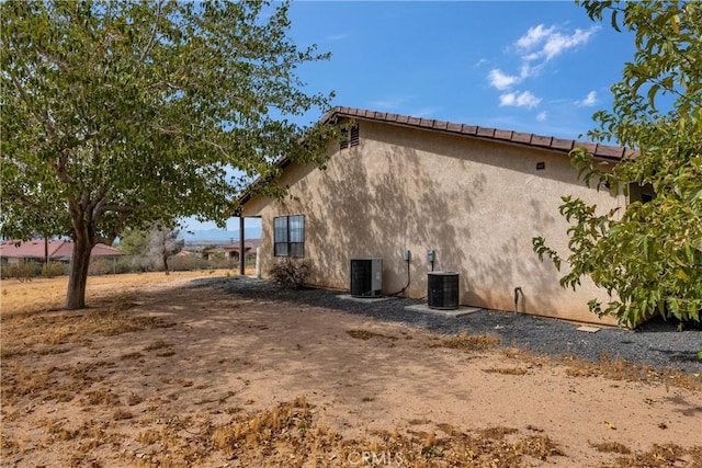 view of home's exterior with central AC