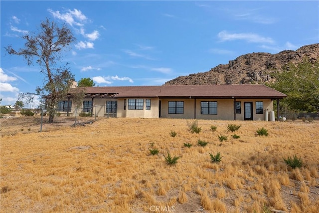 single story home with a mountain view