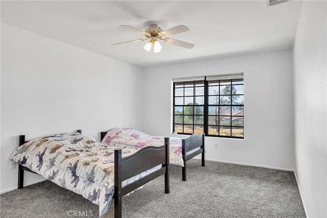 carpeted bedroom with ceiling fan