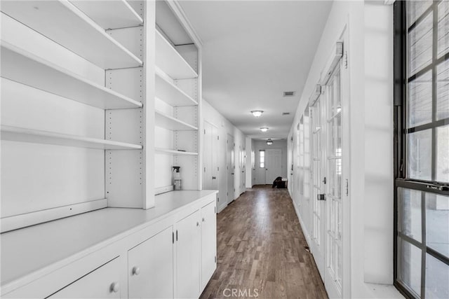 corridor with dark wood-type flooring