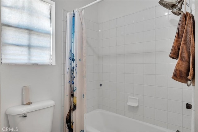 bathroom with shower / tub combo and toilet