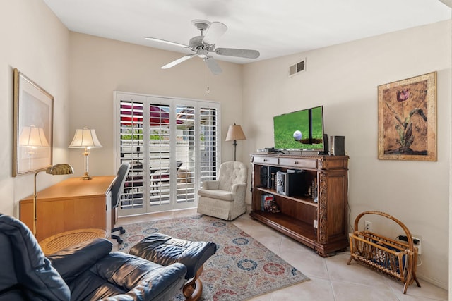 tiled living room featuring ceiling fan