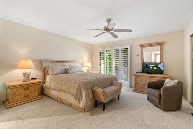 carpeted bedroom featuring ceiling fan and access to outside