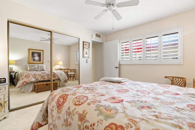 bedroom featuring ceiling fan, a closet, and carpet