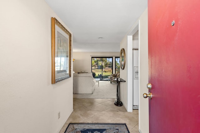 hall with light tile patterned flooring