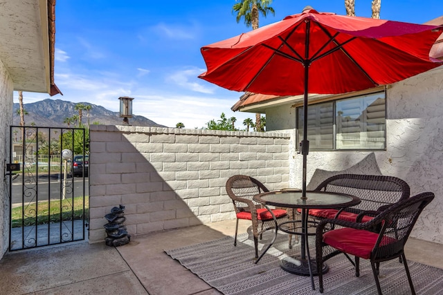 view of patio / terrace with a mountain view