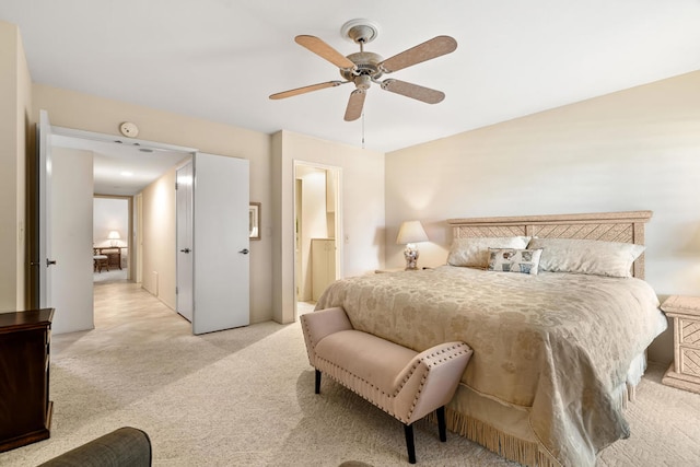 bedroom featuring ceiling fan and light colored carpet