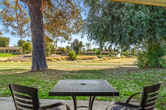 view of property's community featuring a yard