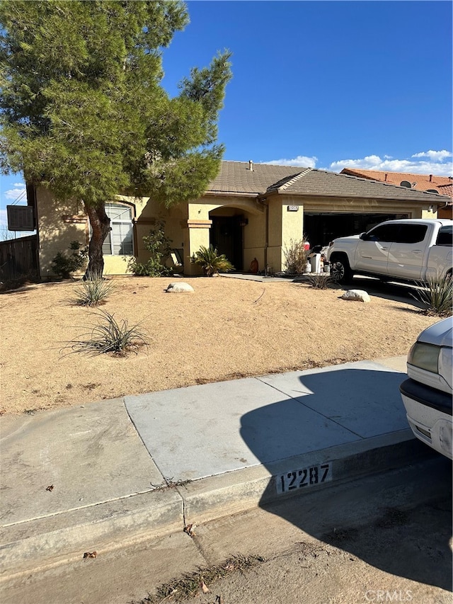 view of front of property featuring a garage