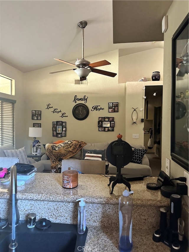 interior space featuring ceiling fan and sink