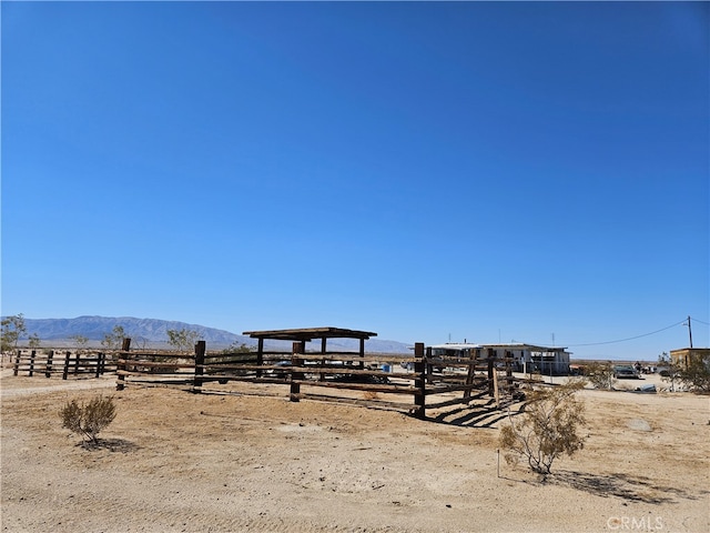 view of yard featuring a mountain view and a rural view