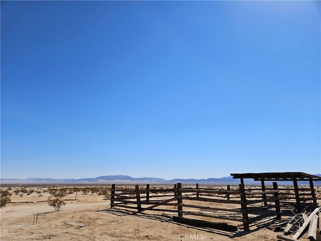 view of yard featuring a mountain view and a rural view