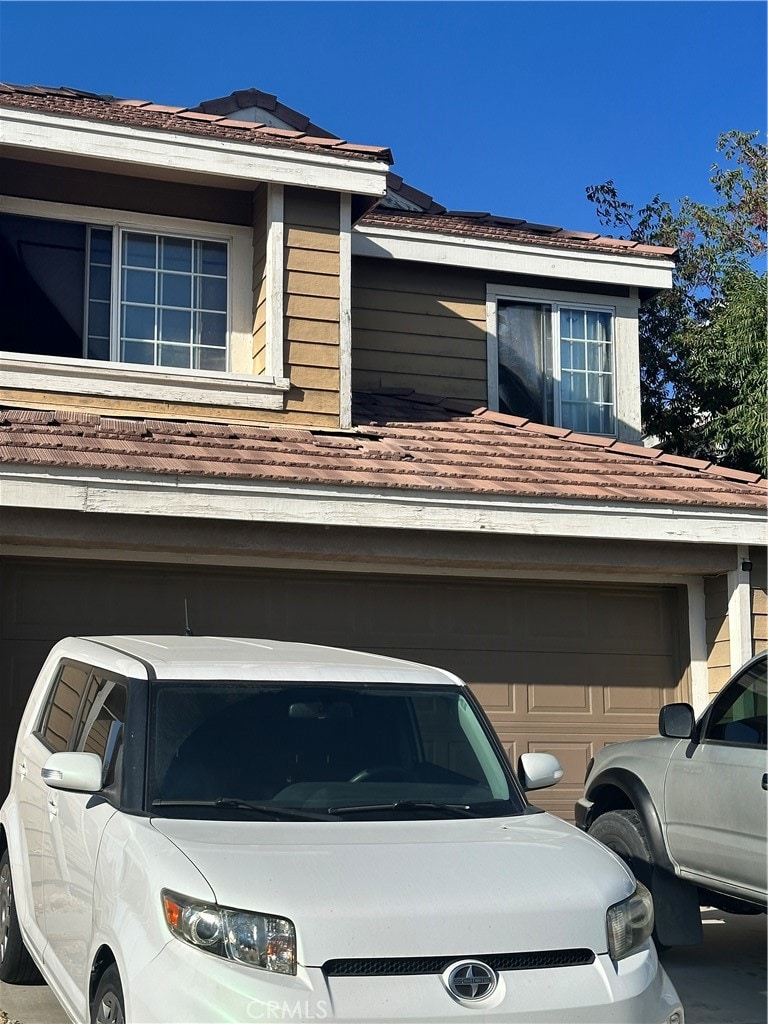 view of side of home with a garage