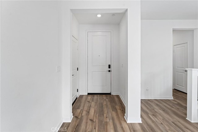 hallway with light hardwood / wood-style flooring