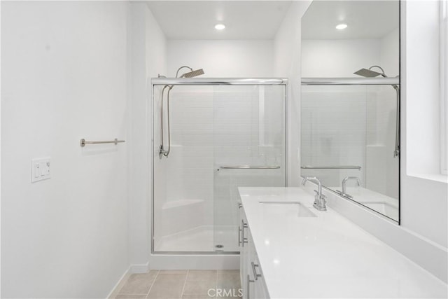 bathroom with tile patterned floors, vanity, recessed lighting, and a stall shower