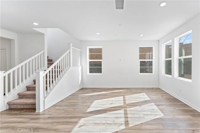 unfurnished room featuring light hardwood / wood-style floors