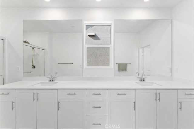 bathroom with vanity and an enclosed shower