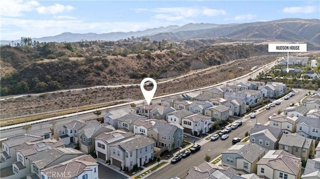 birds eye view of property with a residential view and a mountain view