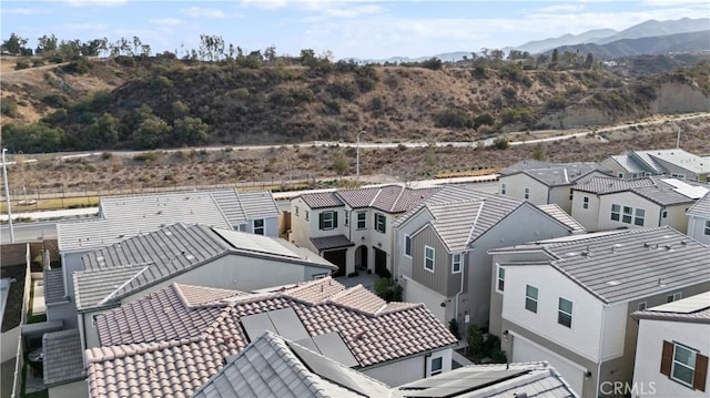 birds eye view of property with a residential view and a mountain view