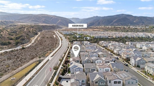 birds eye view of property with a mountain view and a residential view