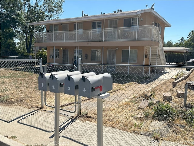 view of front of house with a balcony