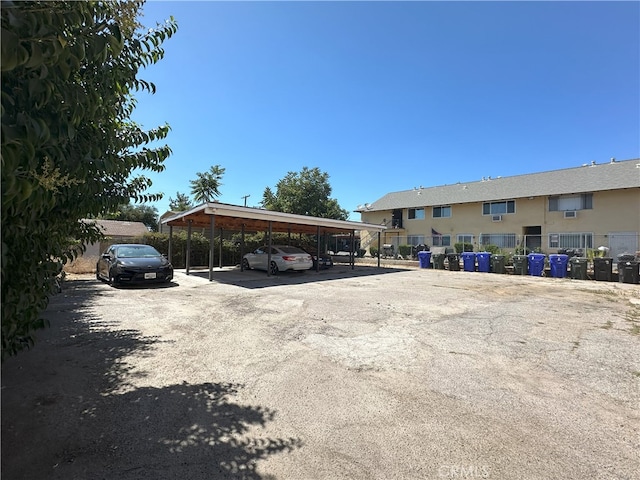 view of vehicle parking featuring a carport