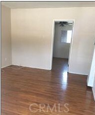 spare room with dark hardwood / wood-style floors