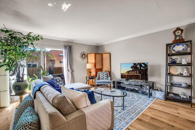 living room featuring ornamental molding and wood-type flooring