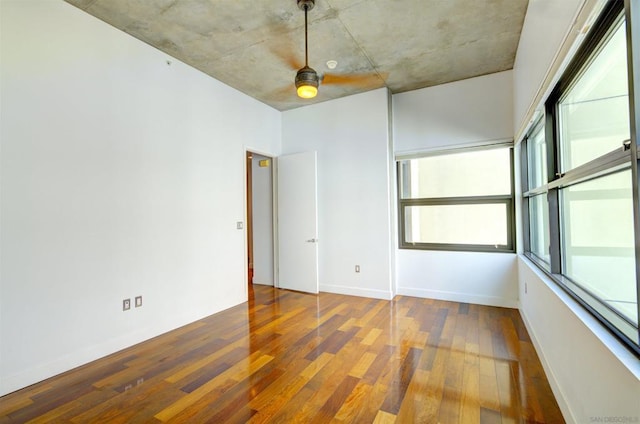 spare room with hardwood / wood-style floors