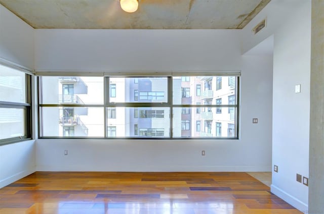 unfurnished room featuring wood-type flooring