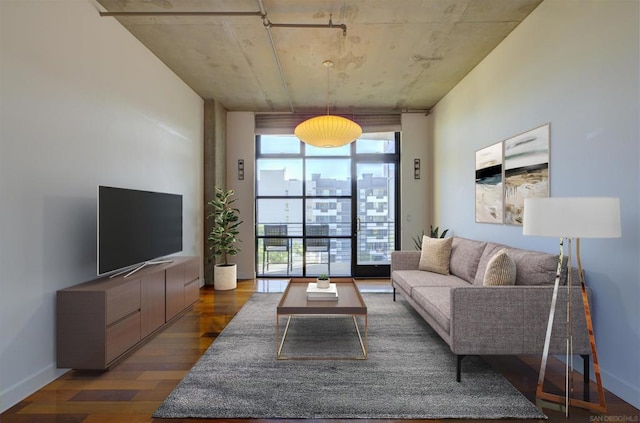 living room featuring floor to ceiling windows, a wealth of natural light, and dark hardwood / wood-style flooring